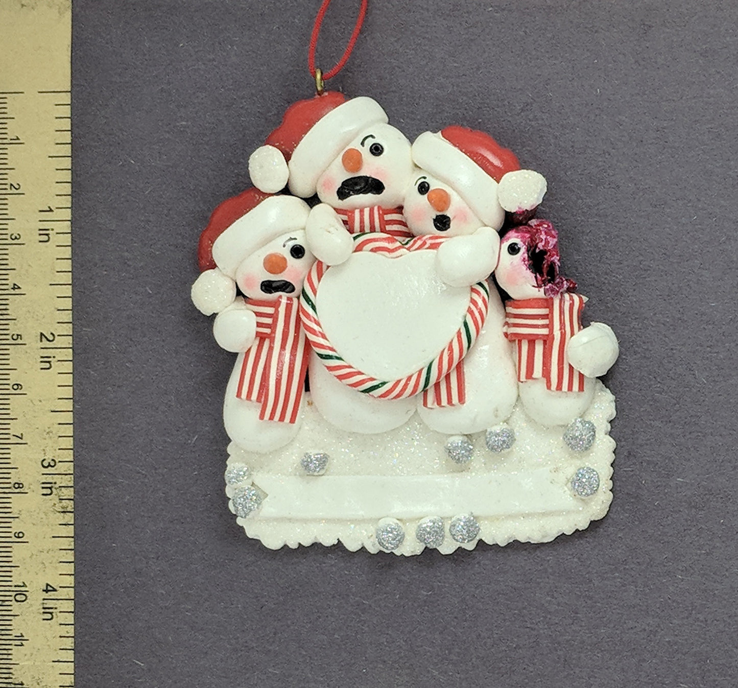 Snowman Family With One Dead Christmas Ornament