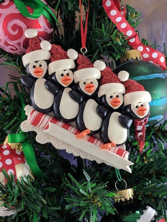 Toboggan Penguins With A Head Christmas Ornament
