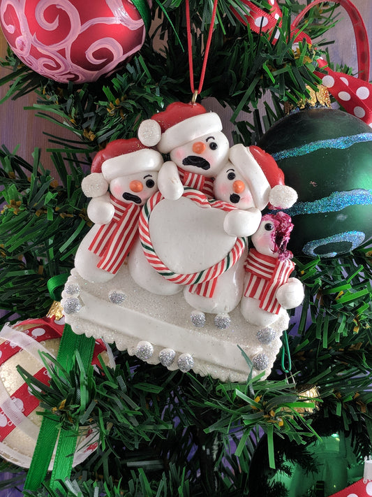 Snowman Family With One Dead Christmas Ornament